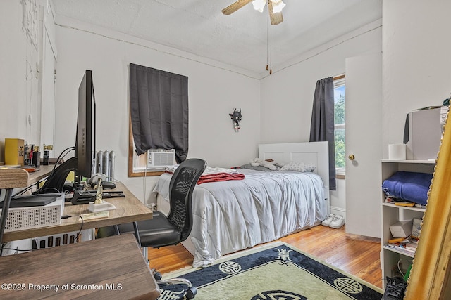 934 W Market St, Scranton, PA 18508 - bedroom featuring wood finished floors, cooling unit, and an office area