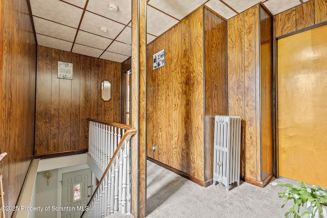 934 W Market St, Scranton, PA 18508 - hall with radiator heating unit, an upstairs landing, carpet flooring, and wood walls