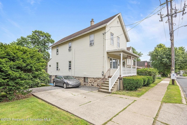 934 W Market St, Scranton, PA 18508 - view of home's exterior with a porch and a chimney