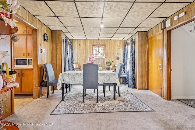 934 W Market St, Scranton, PA 18508 - dining area featuring light carpet and wood walls