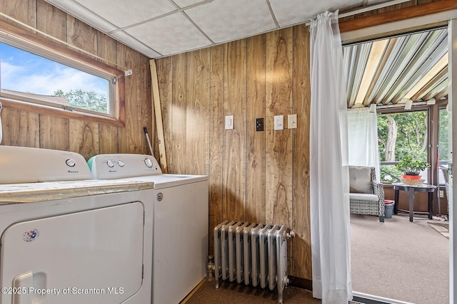 934 W Market St, Scranton, PA 18508 - laundry area with radiator, wooden walls, washing machine and dryer, and carpet