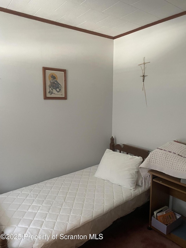 bedroom with ornamental molding