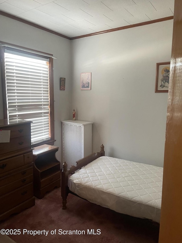 carpeted bedroom with crown molding