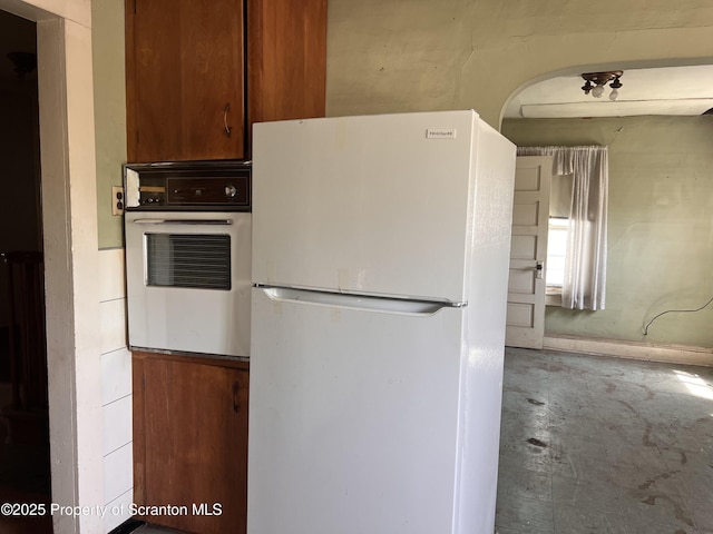 826 N Main St, Forest City, PA 18421 - kitchen with white appliances and concrete floors