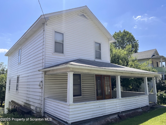 826 N Main St, Forest City, PA 18421 - view of home's exterior with a sunroom