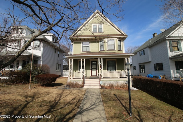 victorian home featuring a porch