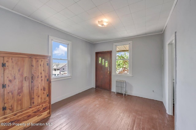 1725 Cedar Ave, Scranton, PA 18505 - entryway with radiator, crown molding, and wood-type flooring