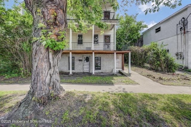 1725 Cedar Ave, Scranton, PA 18505 - view of front of property with brick siding and a balcony