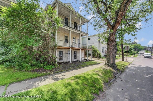 1725 Cedar Ave, Scranton, PA 18505 - view of front of home featuring a balcony and brick siding