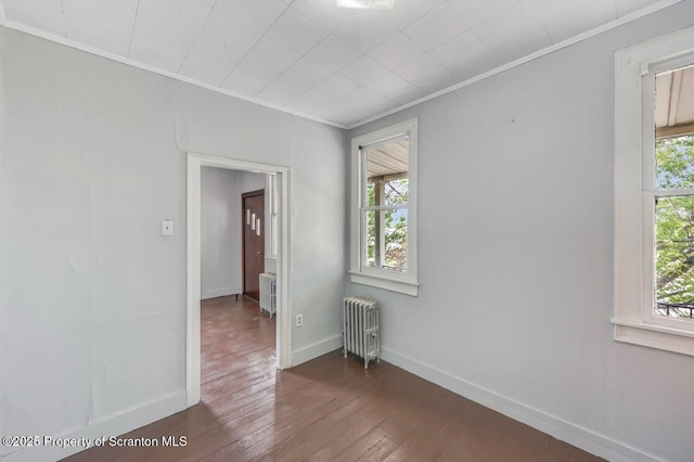 1725 Cedar Ave, Scranton, PA 18505 - spare room with radiator, crown molding, and hardwood / wood-style floors