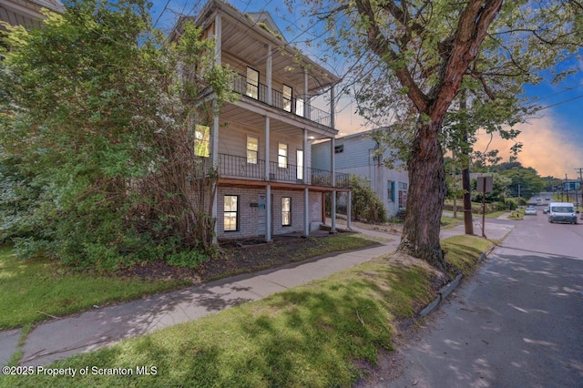 1725 Cedar Ave, Scranton, PA 18505 - property exterior at dusk featuring a balcony