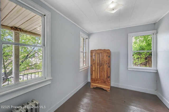 1725 Cedar Ave, Scranton, PA 18505 - spare room featuring crown molding, hardwood / wood-style flooring, and radiator heating unit