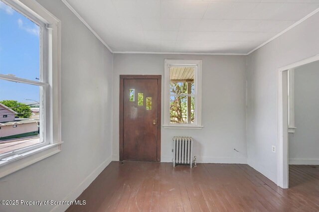 1725 Cedar Ave, Scranton, PA 18505 - entrance foyer with radiator heating unit, wood-type flooring, and ornamental molding