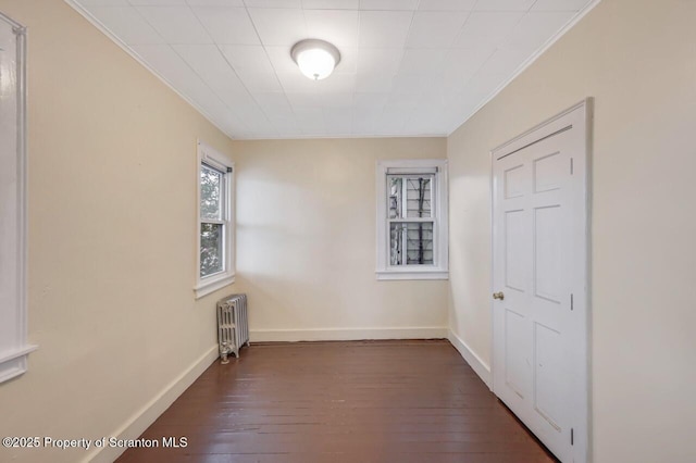 1725 Cedar Ave, Scranton, PA 18505 - empty room with radiator, crown molding, and dark wood-type flooring