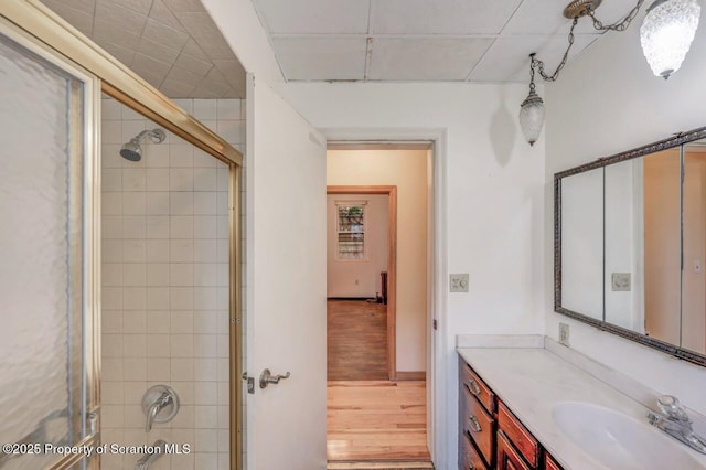 1725 Cedar Ave, Scranton, PA 18505 - bathroom featuring a tile shower, wood finished floors, and vanity