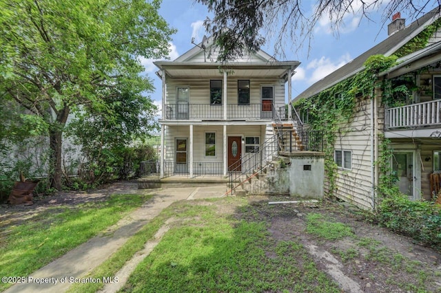 1725 Cedar Ave, Scranton, PA 18505 - view of front of home with covered porch, a balcony, and stairway