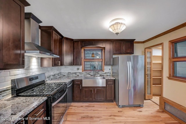1725 Cedar Ave, Scranton, PA 18505 - kitchen featuring stainless steel appliances, wall chimney range hood, light stone counters, dark brown cabinetry, and ornamental molding