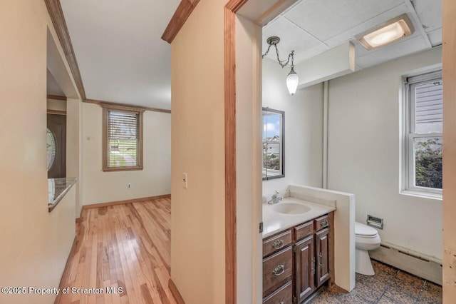 1725 Cedar Ave, Scranton, PA 18505 - bathroom featuring a baseboard heating unit, vanity, and wood finished floors