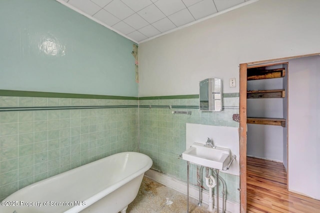 1725 Cedar Ave, Scranton, PA 18505 - full bathroom with a freestanding bath, tile walls, ornamental molding, and a wainscoted wall