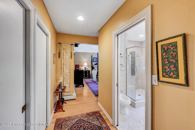 1107 Richmont St, Scranton, PA 18509 - corridor with light wood finished floors, a baseboard radiator, and baseboards