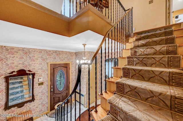 1107 Richmont St, Scranton, PA 18509 - staircase with a chandelier, ornamental molding, wallpapered walls, wood finished floors, and healthy amount of natural light