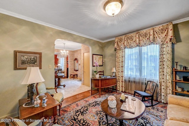 1107 Richmont St, Scranton, PA 18509 - living room with arched walkways, ornamental molding, a chandelier, and wood finished floors