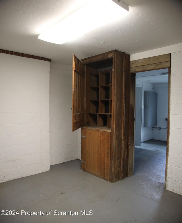basement with concrete block wall