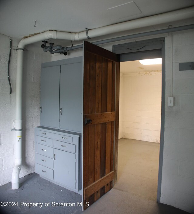 basement with concrete block wall