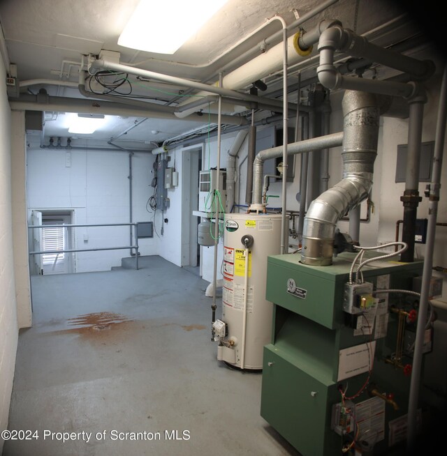 utility room with gas water heater
