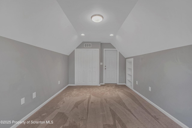 98 Electric St Unit L 1, Clarks Summit, PA 18411 - additional living space with built in features, lofted ceiling, carpet floors, and recessed lighting