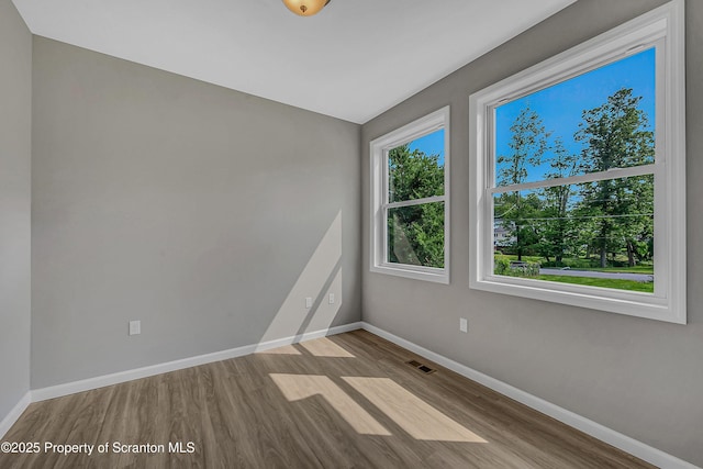 98 Electric St Unit L 1, Clarks Summit, PA 18411 - unfurnished room with wood finished floors and baseboards
