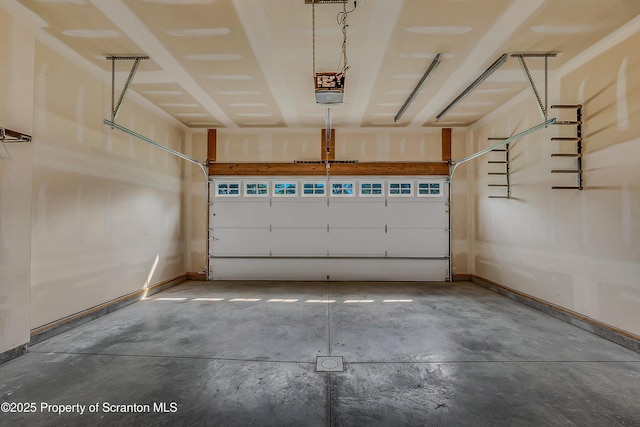 98 Electric St Unit L 1, Clarks Summit, PA 18411 - garage with a garage door opener and baseboards