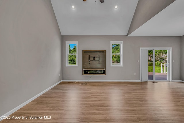 98 Electric St Unit L 1, Clarks Summit, PA 18411 - unfurnished living room with vaulted ceiling, ceiling fan, wood finished floors, and recessed lighting
