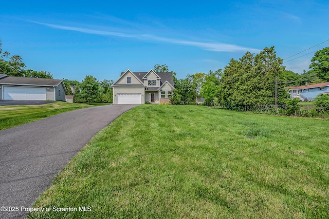 98 Electric St Unit L 1, Clarks Summit, PA 18411 - view of front of house with a front yard, a garage, and asphalt driveway