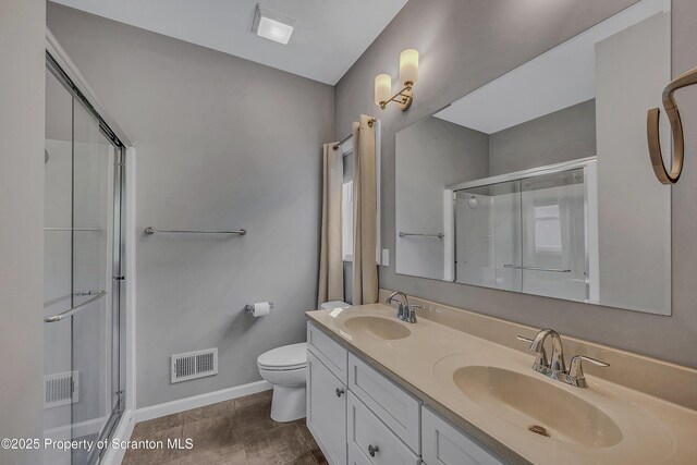 98 Electric St Unit L 1, Clarks Summit, PA 18411 - bathroom with a shower stall and double vanity