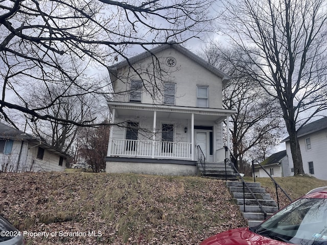 view of front of home featuring covered porch