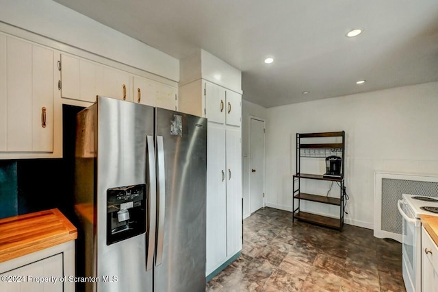 kitchen with electric stove, white cabinets, and stainless steel refrigerator with ice dispenser