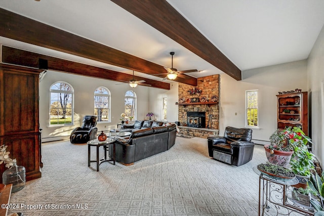 living room featuring light carpet, ceiling fan, a baseboard heating unit, a healthy amount of sunlight, and beam ceiling