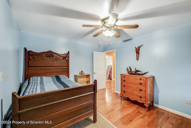 bedroom featuring hardwood / wood-style floors and ceiling fan