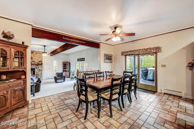 dining area with beamed ceiling, ceiling fan, a fireplace, and a baseboard radiator