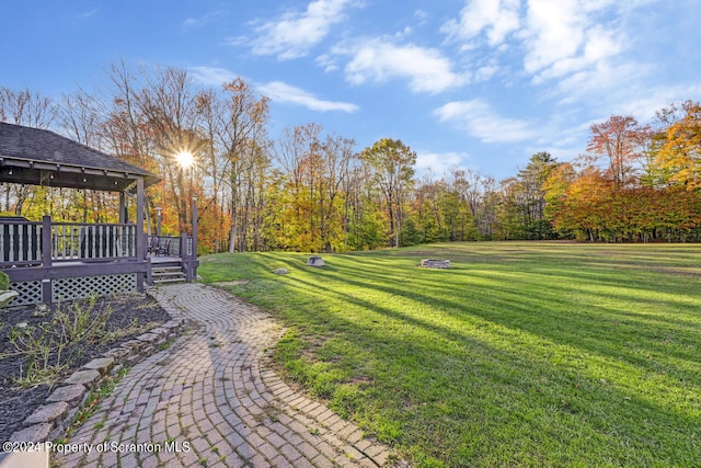 view of yard with a wooden deck