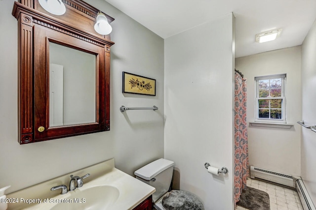 bathroom with baseboard heating, vanity, and toilet