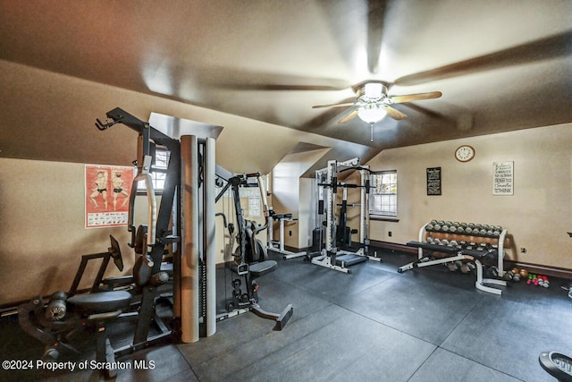 workout area featuring ceiling fan and lofted ceiling