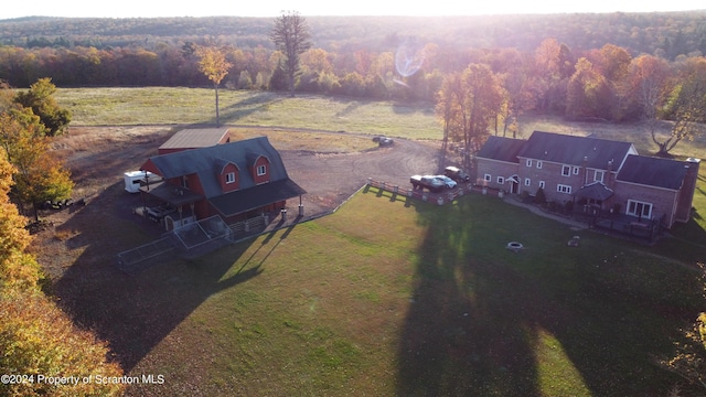 birds eye view of property with a rural view