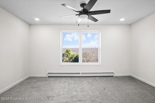 empty room with carpet floors, a ceiling fan, a baseboard radiator, baseboards, and recessed lighting