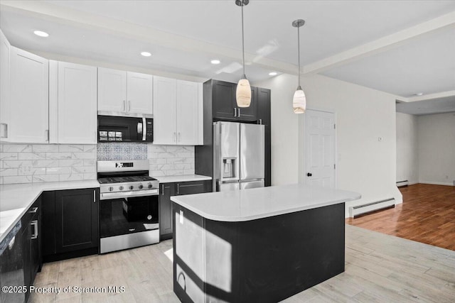 kitchen with backsplash, light wood-style flooring, beam ceiling, and appliances with stainless steel finishes