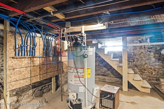 utility room featuring water heater