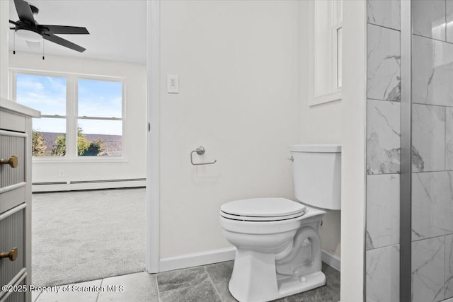 bathroom featuring baseboards, ceiling fan, toilet, and baseboard heating