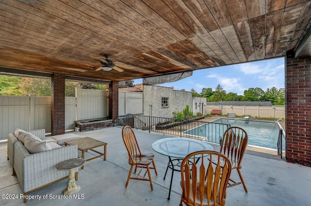 view of patio / terrace with ceiling fan, a fenced in pool, and an outdoor hangout area