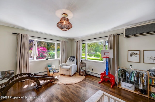 living area featuring ornamental molding, dark hardwood / wood-style floors, an AC wall unit, and a baseboard heating unit